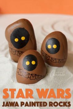 three chocolate eggs decorated to look like monster heads