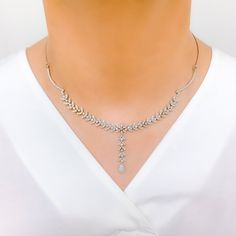 Radiant White Gold Diamond Necklace Set - the perfect addition to any sophisticated ensemble. Crafted from 18k white gold and weighing 24.1 grams, this piece features stunning round diamonds with a total weight of 2.96ct, set in a beautiful 17.5" necklace with a 1.25" drop length. It also comes with matching earrings with a length of 1.25" and screw backs for secure wearing. The lobster lock ensures this set stays safely in place, making it the perfect accessory for any occasion. PRODUCT DETAILS Silver Platinum Bridal Necklace With Single Cut Diamonds, Silver Bridal Necklace With Single Cut Diamonds In Platinum, Platinum Bridal Necklace With Diamond Accents, Silver Platinum Bridal Necklace With Diamond Cut, White Gold Bridal Necklace With 17 Jewels Round Cut, Silver Platinum Bridal Necklace With Diamond Accents, Diamond White Platinum Bridal Necklace, Elegant White Gold Tennis Necklace With Single Cut Diamonds, Fine Jewelry Platinum Bridal Necklace With Diamond Accents