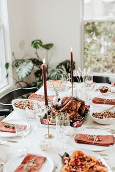 a table set with food and candles