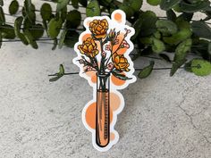 an orange sticker with some flowers in it