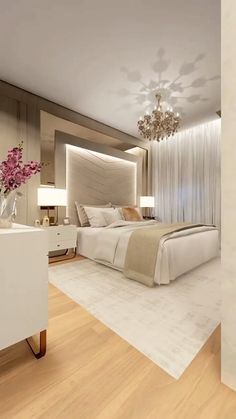 a bedroom with a large bed and chandelier