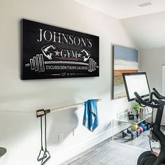 there is a sign on the wall in this room that says, johnson's gym