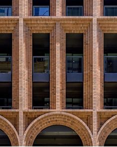 an old brick building with arched doorways