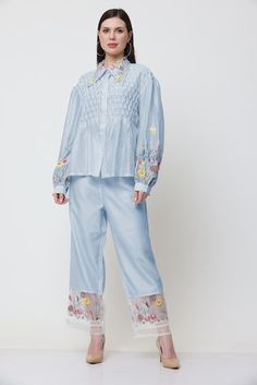 Blue shirt with placed floral thread embroidery, pleated bodice and pearl embellishments. Comes with embroidered pant. - Aza Fashions Floral Embroidered Pants For Spring Workwear, Spring Embroidered Sets With Straight Pants, Embroidered Spring Sets With Straight Pants, Spring Sets With Embroidered Straight Pants, Spring Straight Pants With Resham Embroidery, Straight Pants With Resham Embroidery For Spring, Long Sleeve Sets With Embroidered Hem For Spring, Spring Cotton Pants With Resham Embroidery, Embroidered Pants For Spring Workwear