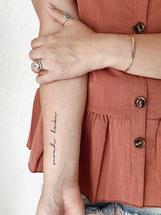 a woman's arm with a tattoo saying, i love you to the moon and back