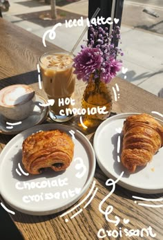 two plates with croissants on them next to a cup of coffee