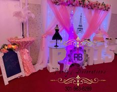 an image of a stage set up for a wedding reception with pink and purple decor