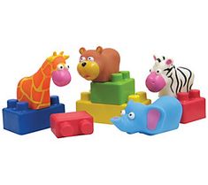 an assortment of toys including animals and giraffes are shown in this image