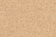 a close up view of the surface of a cork board