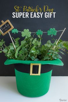 a potted plant sitting on top of a table next to a chalkboard sign