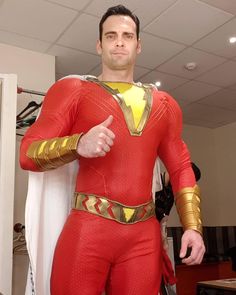 a man in a red and gold costume