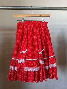 1970s handmade ruffle polka dot red skirt. Good vintage condition. Elastic Waist.  Measurements flat:  27-31" Waist  25" Length All sales final, please ask any questions before you buy! Thanks! Red Ruffled Summer Petticoat, Red Ruffled Petticoat For Summer, Summer Skirt With Attached Cancan In Red, Fitted Red Petticoat For Spring, Red Summer Skirt With Attached Cancan, Summer Red Skirt With Attached Cancan, Vintage Red Ruffled Skirt, Vintage Red Skirt With Ruffles, Vintage Red Fitted Petticoat