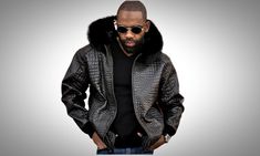 Shop this Men's Real Leather Hooded Bomber Jacket, a versatile and stylish choice crafted for the modern man. Made from genuine leather with a striking alligator print and crocodile embossed details, this jacket exudes sophistication and edge. Designed as a perfect Gift for Him, this bomber jacket features a luxurious fur hood that adds warmth and style. The classic bomber style is enhanced with rib-knitted cuffs and a zipper closure for a snug fit. Key Features & Specifications of this mens jacket: Genuine Leather Croc Embossed: Ensures durability and a unique aesthetic. Bomber Style: Classic and timeless design suitable for various occasions. Zipper Closure: Provides a secure and modern fit. Viscose Lining: Offers comfort and breathability. Rib-knitted Cuffs: Enhances the jacket's style Fitted Crocodile Pattern Outerwear For Winter, Luxury Winter Outerwear With Crocodile Pattern, Luxury Crocodile Pattern Winter Outerwear, Luxury Leather Outerwear With Double-lined Hood, Fur Hood Jacket Men, Luxury Leather Jacket With Double-lined Hood For Men, Hood Jacket, Dry Cleaning Services, Fur Hood Jacket