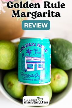 a can of golden rue margarita sits in front of some limes