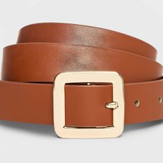 Instantly enhance any of your looks with this Chunky Center Bar Buckle Belt from A New Day™. This neutral tan belt offers easy styling with a range of outfits. It features a chunky square-shaped buckle closure for a touch of shine and chic style. This stylish women's belt with multiple holes provides an adjustable, secure fit around your waist. Whether paired with formal trousers or wrapped around the waist of a dress, this center bar belt lends on-trend flair to any outfit. A New Day™: Style th Trendy Brown Belt For Workwear, Brown Belts For Spring Workwear, Cowgirl Look, Tan Belt, Women's Belt, Formal Trousers, Branded Belts, Buckle Belt, Tan Color