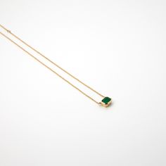 This necklace was the result of the "Emerald project", created between a group of friends with the need to share feelings, it represents that spark of light in your heart when you think about friendship. - Handmade necklace- Adjustable recycled 14k yellow gold chain measures 210mm or 160mm long- Emerald is set in handcrafted, recycled 14k yellow gold Fine Jewelry Square Pendant Necklace For Gift, Minimalist Gemstone Necklaces For May Birthstone, Minimalist May Birthstone Crystal Necklace, Fine Jewelry Square Pendant Necklace With Birthstone, Fine Jewelry With Rectangular Birthstone, Minimalist Jewelry With Rectangular Birthstone, Minimalist Emerald Jewelry Gift, Minimalist Necklace With Rectangular Stone As Gift, Minimalist Necklace With Rectangular Stone For Gift