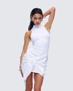 We love a classy babe ☁️ Made from a blend of jersey and satin fabric, this white mini dress is a bodycon style with wrap sash detailing, creating a look that is perfect for making an impression that sticks 🤍 White Draped Mini Dress For Cocktail, Elegant White Draped Mini Dress, White Draped Mini Dress For Evening, Elegant White Wrap Dress For Party, Chic Asymmetrical Stretch Mini Dress, Summer Draped Stretch Bodycon Dress, White Draped Mini Dress For Spring, Fitted Asymmetrical Wrap Dress, White Fitted Draped Mini Dress