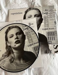 a black and white photo of a woman's face on newspapers