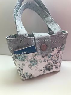 a small purse with a card in it