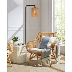 a living room with wicker furniture and plants