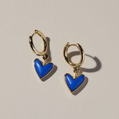 Blue Stone Sweetheart Huggies - Nickel & Suede Trendy Blue Heart Earrings For Gift, Gold Plated Huggie Earrings With Heart Charm, Trendy Blue Jewelry With Heart Charm, Blue Small Hoop Huggie Earrings, Blue Huggie Hoop Earrings, Blue Tarnish Resistant Hoop Earrings, Blue Tarnish-resistant Hoop Earrings, Blue Hoop Earrings Gold Plated, Blue Tarnish Resistant Huggie Jewelry