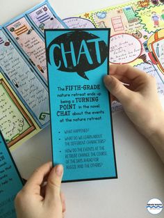 a person holding up a blue bookmark with the words chat on it in black and white