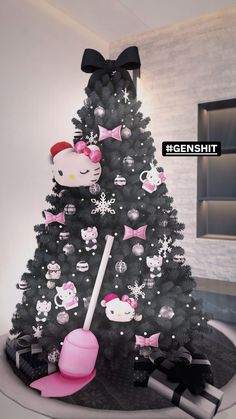 a christmas tree with hello kitty decorations on it