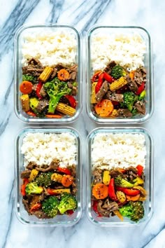 four plastic containers filled with rice and veggies on top of a marble counter