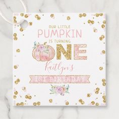 a pink and gold birthday card with the words, our little pumpkin is turning one kitty's first birthday