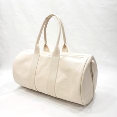 This beautiful round duffel made from a heavy weight cotton canvas will give you years of happy use. It's washable, carries great and is of high quality at an affordable price.If you have chosen personalization, please leave a note at checkout with the name you would like added. Material: Heavy Weight Cotton CanvasSize: 22" x 12"White Coil ZipperMade in the U.S.A.PROCESSING TIME:Your product will ship in 1-5 business days. Canvas Travel Bag, Front Pocket Wallet, Pocket Wallet, Bag Canvas, Gift Ideas For Men, Duffel Bag, Heavy Weight, Canvas Size, Natural Cotton