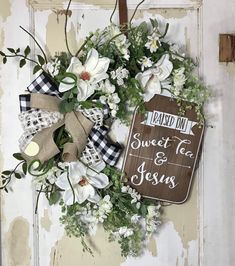 a wreath with flowers and a sign that says, i learned to sweet tea and jesus