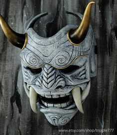 a white mask with horns on it's head