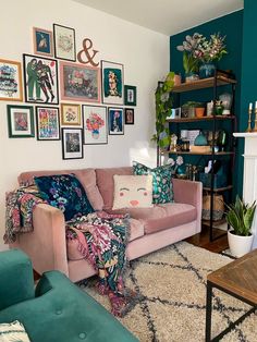 a living room filled with furniture and lots of pictures on the wall above it's fireplace