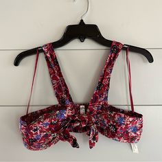 Free People Intimately Bralette Top Size: Small Color: Dark Red With Blue, Pink And Black Floral Pattern Bandeau Style With Straps Tie Front Ruched/Smocked Back Materials Listed In Photos Removed Tags But Never Wore Reasonable Offers Welcome (: Clean, Smoke-Free Home More Info Available Upon Request! Summer Beach Bra With Floral Print, Floral Print Underwire Bra For Beach, Floral Print Underwire Bra, Bandeau Tops With Straps For Beach, Red Bandeau Halter Top, Red Summer Bra, Summer Bra Friendly Red Halter Top, Summer Red Halter Top, Bra Friendly, Black Floral Pattern