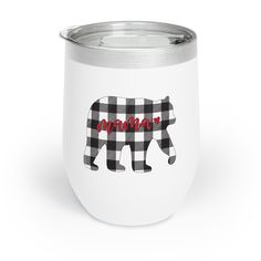 a black and white plaid bear tumbler with the word mama on it's side