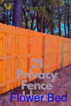 a wooden fence with the words 21 privacy fence flowerbed