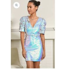 This Bold Dress Is Made From Iridescent Sequins Which Will Draw The Eye, Making You Stand Out In Any Room. With A V-Neck, Puff Sleeves, And Unique Shine, This Dress Will Have You Looking Glamorous. Sequin Dress Puff Sleeves V-Neck Length: 34 1/4" Chest: 17 1/4" Waist: 14 1/2" Lined Self: 100% Polyester Lining: 100% Polyester Hand Wash Cold With Similar Colors. Do Not Tumble Dry, Iron, Or Dry Clean. Model Is Wearing A Size S Holographic Sequin Dress, Bold Dress, Eyelet Maxi Dress, Iridescent Sequin, Bold Dresses, Red Sleeveless Dress, Crochet Lace Dress, Light Dress, Hot Pink Dresses