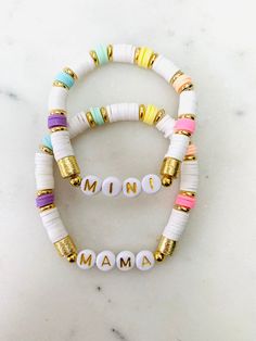 🌈 Gold accent white and bright colored Mama & Mini bracelet set. Colorful bracelet with heishi beads in rainbow order with white and gold accents make this a perfect addition to your colorful summer wardrobe just in time for Mother's Day. Please note any customizations in the personalization section. 🌈 Listing is for TWO bracelets (one Mama, and one Mini) 🌈 Sizing length is as follows:  Women's small: 6.5 inches Women's medium: 7 inches Women's large: 7.5 inches Women's XL: 8 inches Children' Bracelet Combos, Mama Bracelet, Rainbow Order, Mini Bracelet, Mama And Mini, Bracelet Inspo, Bracelets Ideas, Preppy Jewelry