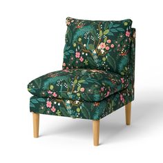 a green floral chair with wooden legs