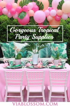 a table set up for a tropical party