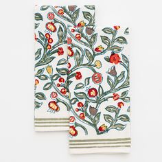 two white towels with floral designs on them