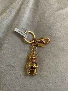 NWT Coach Gold Teddy Bear Keyfob Charm F87166 Coach Bag Charm Ideas, Coach Bag Charm, Coach Tabby Bag, Coach Charms, Purse Decor, Coach Nolita 19, Jewellery Stack, Gold Teddy Bear, Coach Nolita