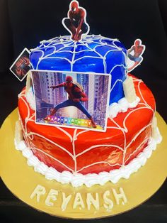 a spiderman birthday cake is decorated with photos and the words, revanish