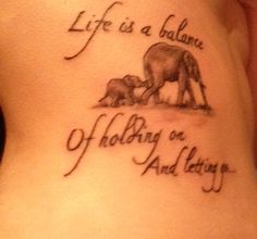 a woman with a tattoo on her stomach saying life is a balance of holding on and letting