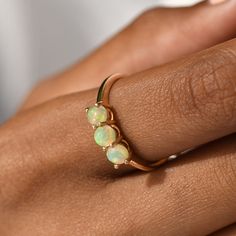 "Genuine Opal Ring/Dainty Opal Three Stone Ring/Ethiopian Opal Minimalist Ring/14k Solid Gold/Layering Statement Ring/Stackable Matching Ring ★ ★ ★ ★ CUSTOM/DUTY-FREE SHIPPING WORLDWIDE, BUYERS DON'T HAVE TO PAY ANY CUSTOM FEES WHILE IMPORTING ★ ★ ★ ★ Details Made to order Material: 14k/18k Gold Color Options: Yellow Gold, White Gold, Rose Gold ★ Center Stone Natural Opal, Round Size: 4 mm * 3 Nos Approx Weight (Ct): 0.665 ★ 100% Natural Diamond and Gemstones ★ Diamond: Round Brilliant cut, G-H Classic Ethiopian Opal Gemstone Rings, Heirloom Ethiopian Opal Round Ring, Classic Ethiopian Opal Ring As A Gift, Classic Ethiopian Opal Jewelry For Anniversary, Yellow Gold Stackable Opal Ring For Promise, Adjustable Yellow Gold Opal Ring For Anniversary, Fine Jewelry Rings With Ethiopian Opal Birthstone, Fine Jewelry Ethiopian Opal Birthstone Rings, Dainty Round Ethiopian Opal Jewelry