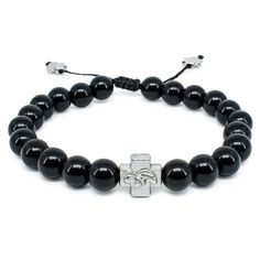 Beautiful handmade black onyx stone prayer bracelet, made with genuine onyx stone beads. This bracelet has one divider cross bead with the Holy Theotokos (Virgin Mary) on one side and a decorative cross on the other. Size can be adjusted due to the sliding knot, when you pull on the 2 ropes the bracelet tightens. ... Zodiac Stones, Prayer Bracelet, Black Onyx Bracelet, Crosses Decor, Metal Cross, Birthstone Bracelet, Black Onyx Stone, Onyx Bracelet, Birthstone Bracelets