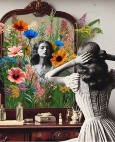 a woman looking at herself in front of a mirror with flowers on the wall behind her