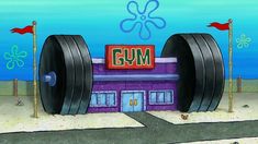 an image of a cartoon building with giant tires in front of it and the word gym on top