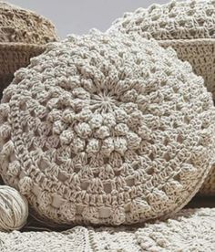 several crocheted baskets are stacked on top of each other