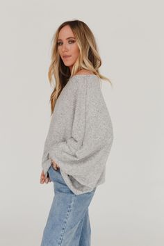 An essential, everyday sweater is the Fly With Me Batwing Sleeve Knit Sweater - the perfect silhouette to add a boho pop to any bottoms! This will become your new wardrobe staple because it features: Cozy, stretch knit fabric Relaxed and loose fit Batwing long sleeves Boat neckline An everyday boho outfit pair with: Seamless Layering Tank, Kick The Dust Up Flare, Kasia Layered Necklace *Due to lighting and differences in monitors, actual colors may vary slightly from what appears online. Model i One-size Batwing Sleeve Sweater For Layering, Casual Batwing Sleeve Sweater For Layering, One Size Batwing Sleeve Sweater For Layering, Versatile Long Sleeve Top For Fall, Versatile Long Sleeve Top For Everyday Fall Wear, Cozy Oversized Fine Knit Tops, Gray Sweater For Layering With Soft Texture, Oversized Winter Knit Top For Layering, Casual Knit Long Sleeve Top For Winter